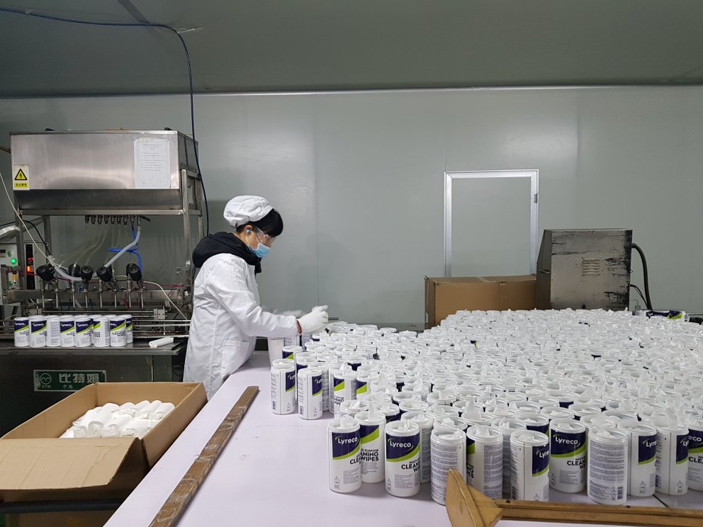 A worker is sorting Lyreco products
